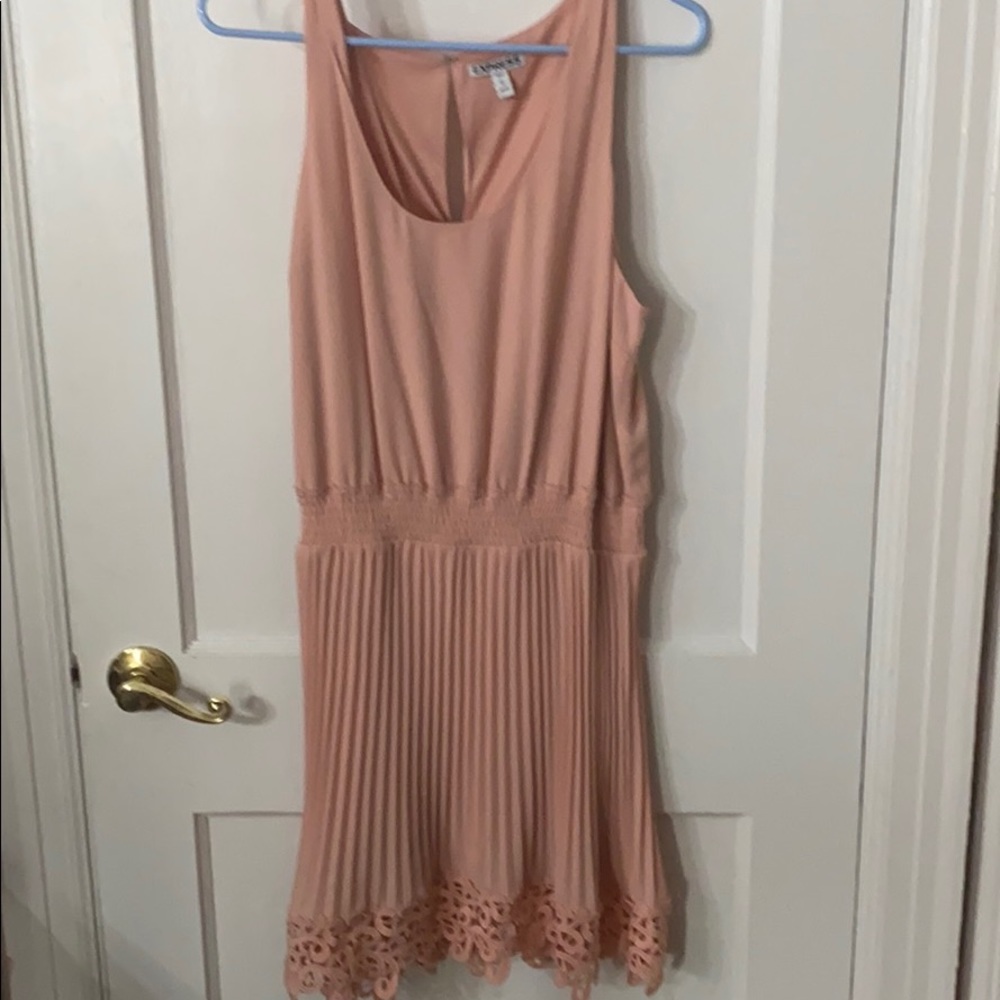 Mini dress with pleats and lace on hem